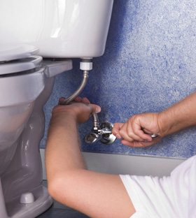 Westminster plumbing contractor tightens water intake line on Toto toilet